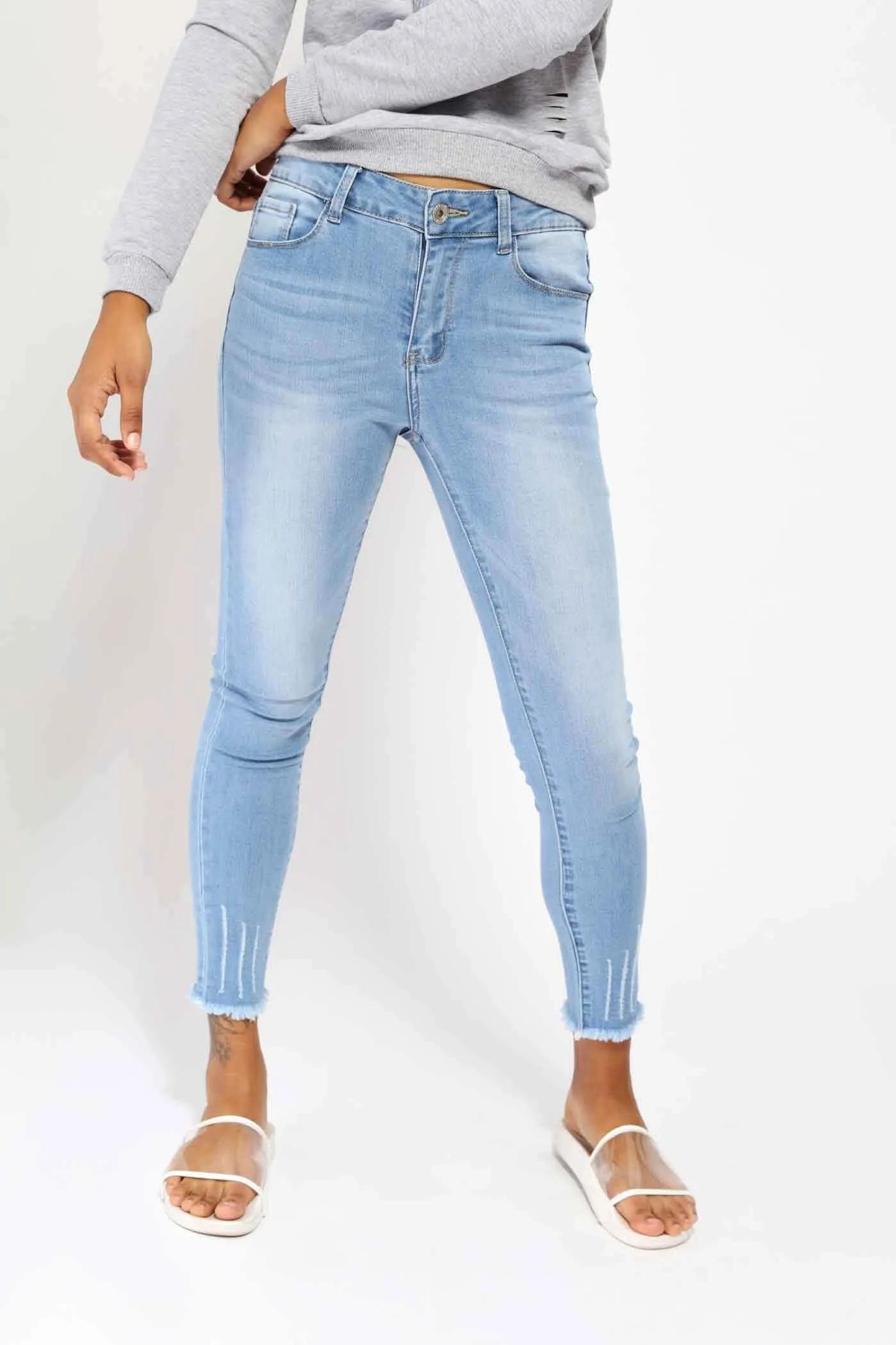 Blue Mid Rise Ripped Jeans With Frayed Hems