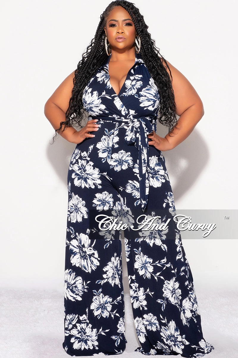 Reflective accents Elasticized Cuffs Final Sale Plus Size Faux Wrap Halter Jumpsuit with Waist Tie in Navy and White Floral Print