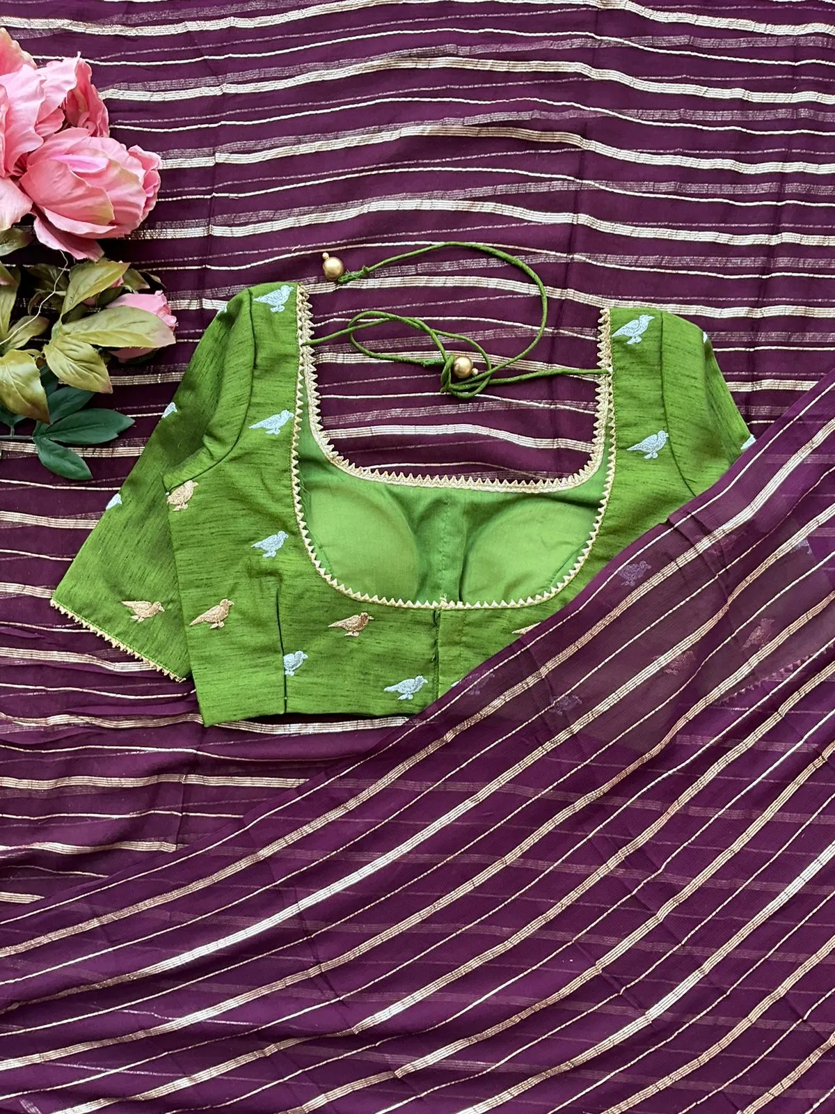 Purple chiffon saree with green hand worked blouse