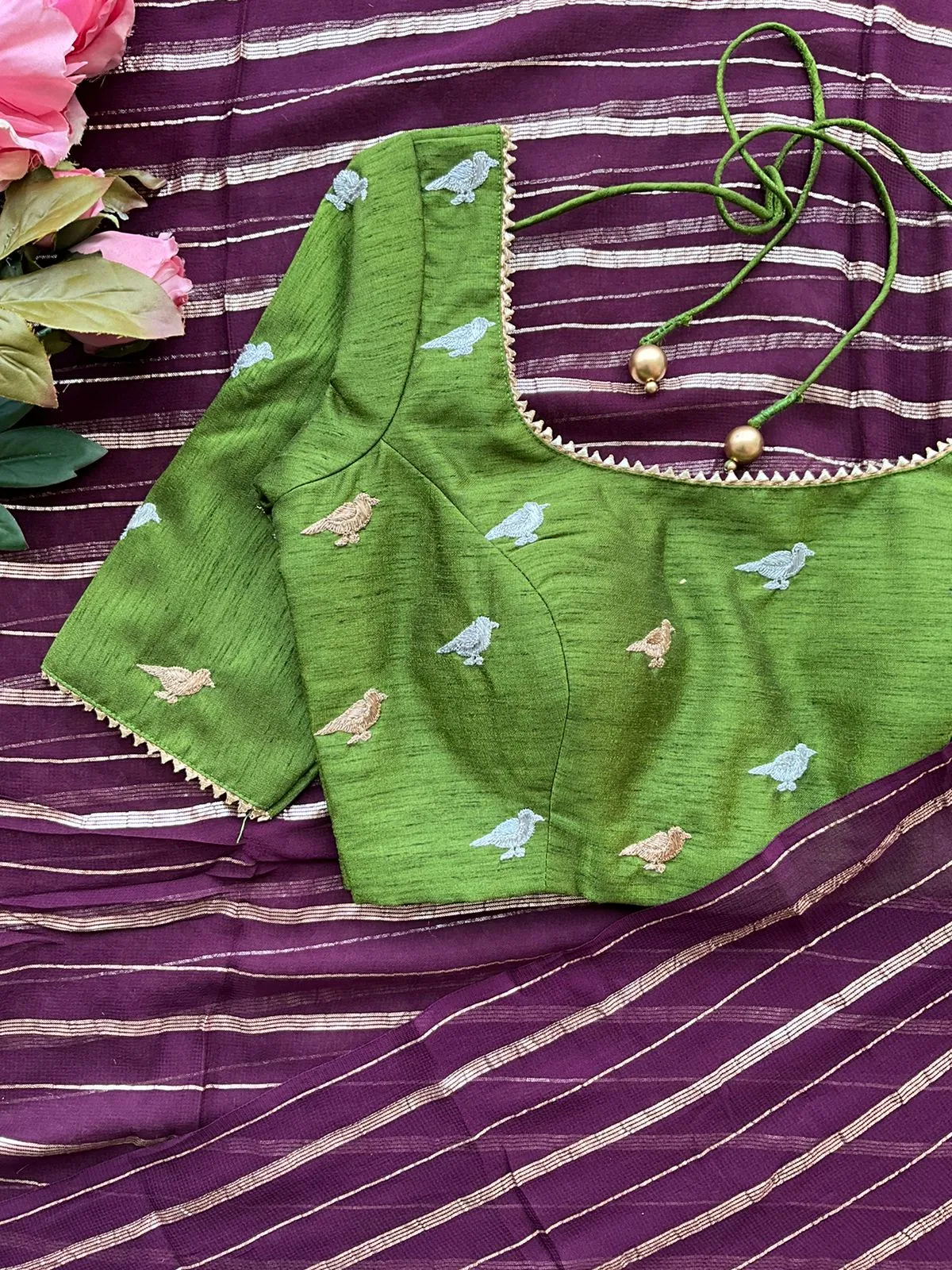 Purple chiffon saree with green hand worked blouse